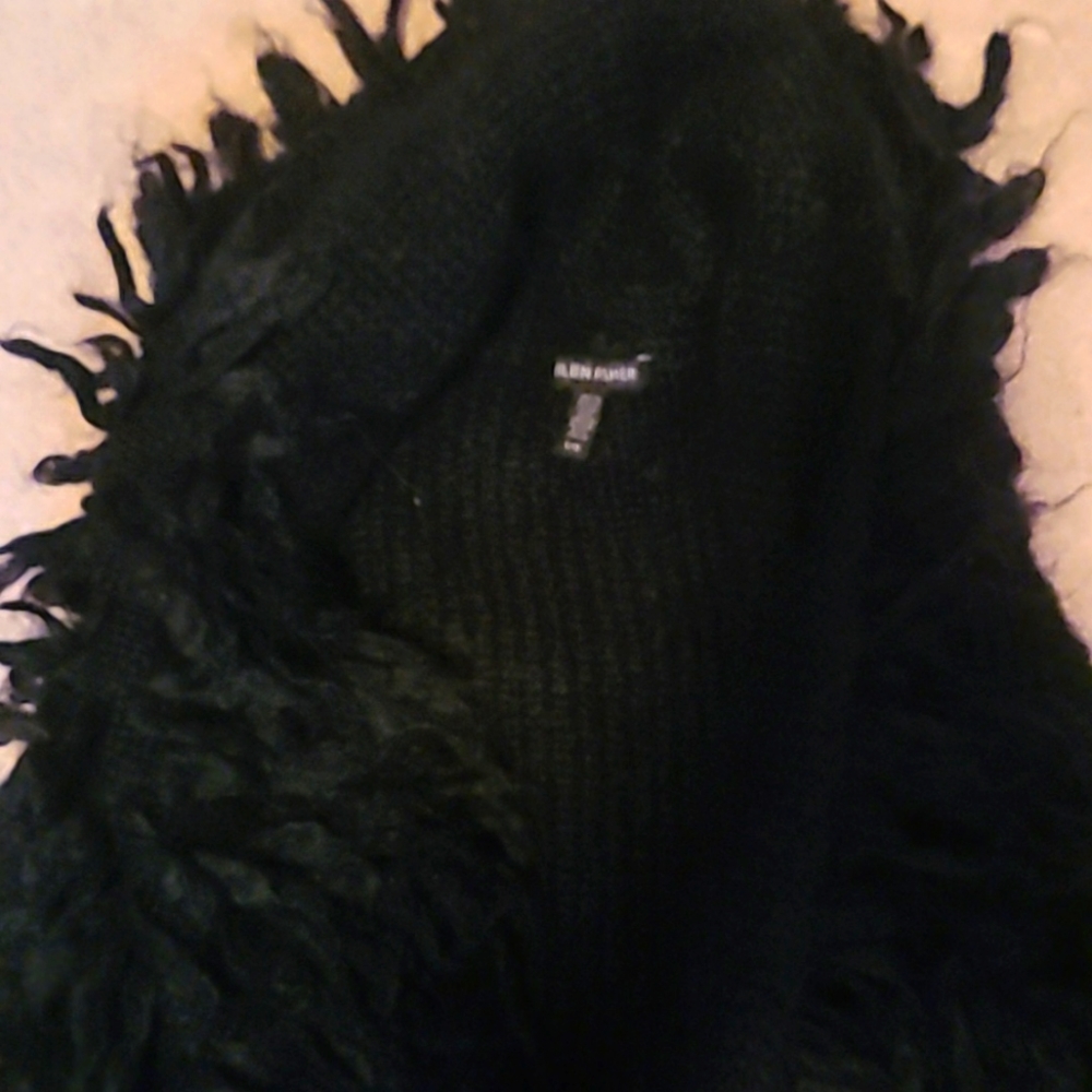 Vintage black sleeveless vest made from Italian  yarn. Size Lg